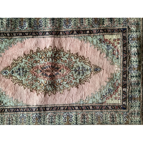 679 - A Tabriz style rug, silk and wool pink central ground  89 x 155cm