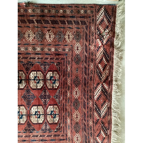 680 - Persian style rug, red ground, with tears and losses 130cm x 295cm]