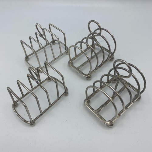 120 - Two pairs of miniature Sterling silver toast racks, Atkin Brothers, Sheffield, 1911, and Charles & G... 