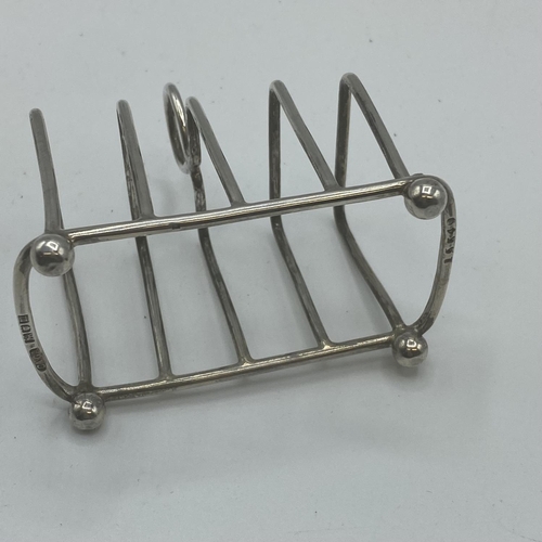 120 - Two pairs of miniature Sterling silver toast racks, Atkin Brothers, Sheffield, 1911, and Charles & G... 