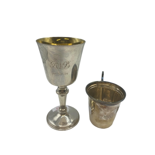 122 - A Sterling silver wine goblet with gilt interior by WI Broadway, Birmingham 2000 together with a Ste... 