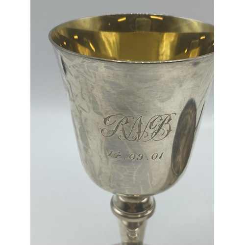 122 - A Sterling silver wine goblet with gilt interior by WI Broadway, Birmingham 2000 together with a Ste... 