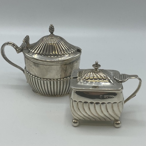 125 - A collection of sterling silver table items to include a pair of Adams Style Pepperets, A pepper gri... 