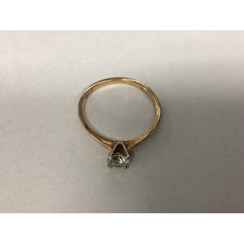 17 - An 18ct gold single stone diamond ring. Brilliant cut diamond in a four claw setting. Diamond approx... 