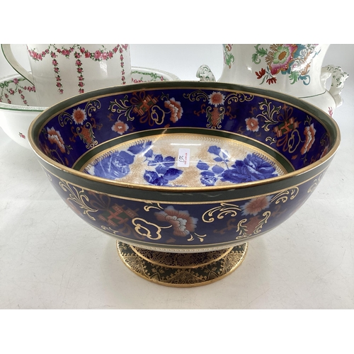 203 - A large Royal Doulton footed presentation bowl in blue floral and gilt pattern, 31cmDiam, a large wa... 