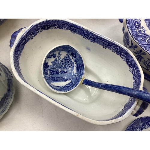 208 - A quantity of blue and white decorative china, some with cracks, to include Wedgwood, Willow Pattern... 