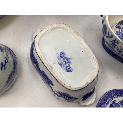 208 - A quantity of blue and white decorative china, some with cracks, to include Wedgwood, Willow Pattern... 