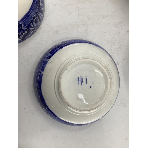 208 - A quantity of blue and white decorative china, some with cracks, to include Wedgwood, Willow Pattern... 