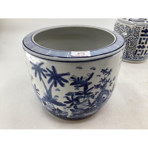 208 - A quantity of blue and white decorative china, some with cracks, to include Wedgwood, Willow Pattern... 