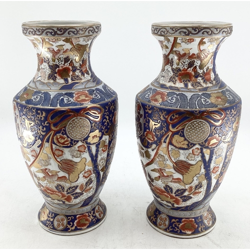 215 - A pair of Japanese vases, decorated in the Imari Palette, red stamp to base, hand painted, 38.5cmH