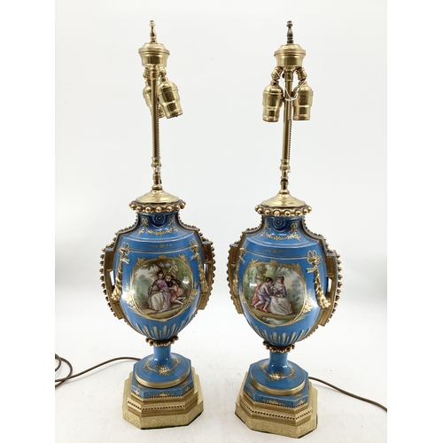 216 - A pair of Continental Meissen Style lamps, on stepped gilded base, the blue body with central oval p... 