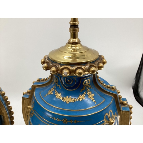 216 - A pair of Continental Meissen Style lamps, on stepped gilded base, the blue body with central oval p... 