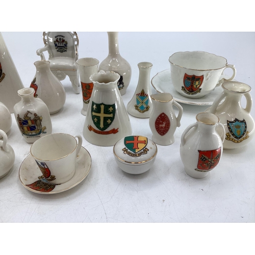 231 - A collection of ceramic crested ware, various makers