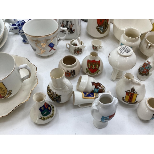 326 - Quantity of Goss crested China ware, and Commemorative memorabilia mugs, and a Copeland Spode Victor... 