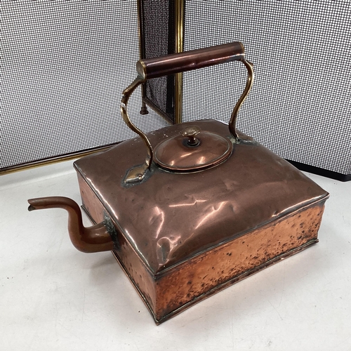 341 - A large Victorian square copper kettle, and 2 fire guards