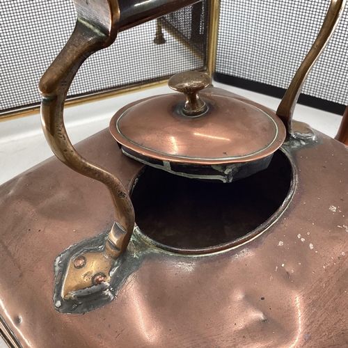 341 - A large Victorian square copper kettle, and 2 fire guards