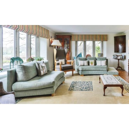 560 - A pair of modern, olive green/blue upholstered curved shaped sofas and matching stools (some wear)