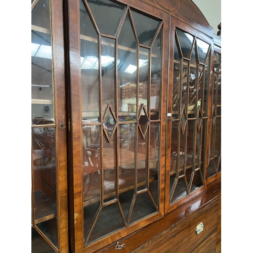 569 - A good Regency breakfront inlaid mahogany library bookcase, with glazed upper parts, 260cmH x 244cmW... 