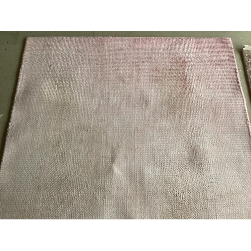 678 - Two modern rugs, pink by Laura Ashley (some wear), 140 x 200cm; and cream ground rug labelled Gooch ... 