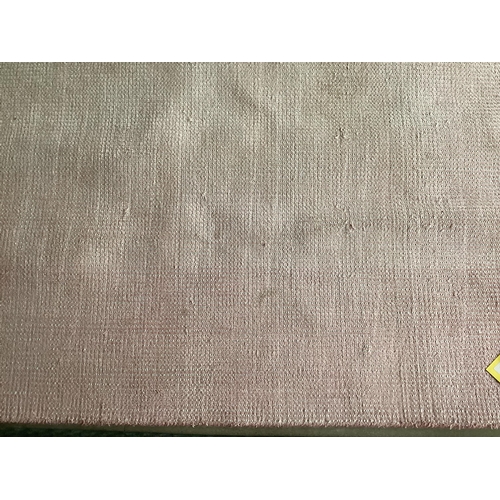 678 - Two modern rugs, pink by Laura Ashley (some wear), 140 x 200cm; and cream ground rug labelled Gooch ... 