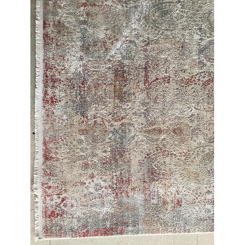 678 - Two modern rugs, pink by Laura Ashley (some wear), 140 x 200cm; and cream ground rug labelled Gooch ... 