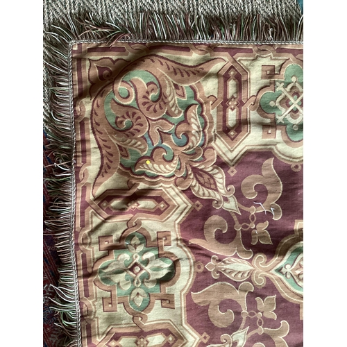 683 - Needlepoint throw, with a maroon central coloured ground, and with brown fabric backing, 145 x 180cm