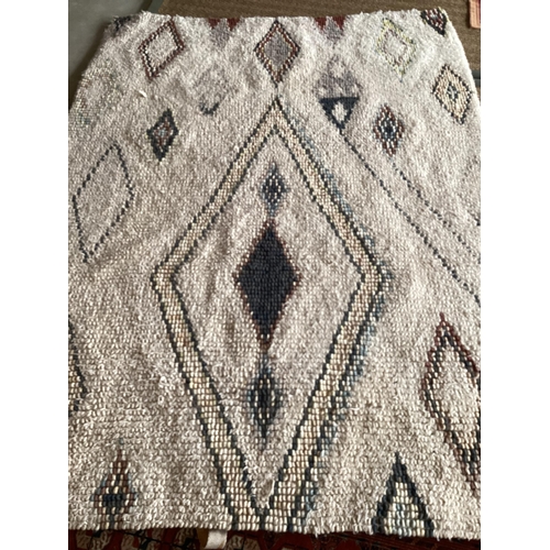 684 - A modern Berber cream rug, with  colour diamond geometric design patterns 180 x 246cm