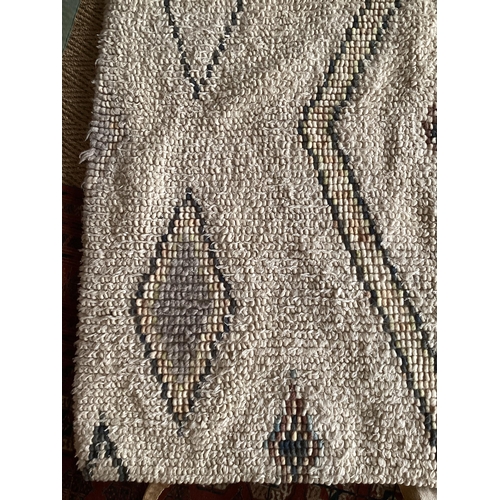 684 - A modern Berber cream rug, with  colour diamond geometric design patterns 180 x 246cm