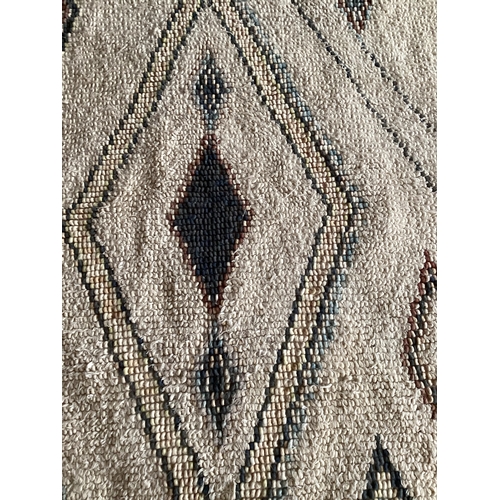 684 - A modern Berber cream rug, with  colour diamond geometric design patterns 180 x 246cm