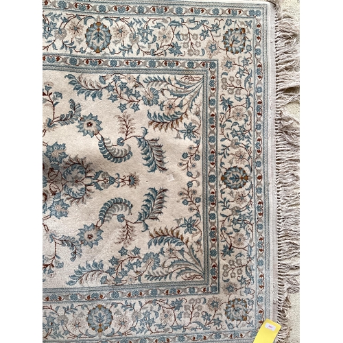 688 - An excellent quality  near pair of rugs, Persian, silk and wool, with beige ground and blue floral d... 