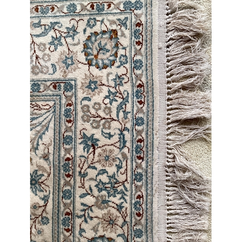 688 - An excellent quality  near pair of rugs, Persian, silk and wool, with beige ground and blue floral d... 