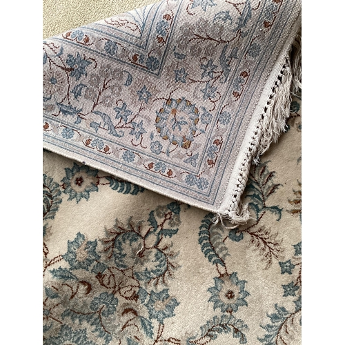 688 - An excellent quality  near pair of rugs, Persian, silk and wool, with beige ground and blue floral d... 