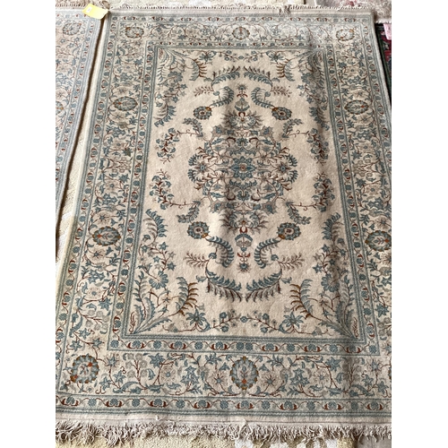 688 - An excellent quality  near pair of rugs, Persian, silk and wool, with beige ground and blue floral d... 