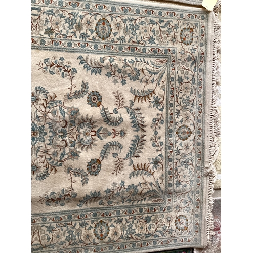 688 - An excellent quality  near pair of rugs, Persian, silk and wool, with beige ground and blue floral d... 