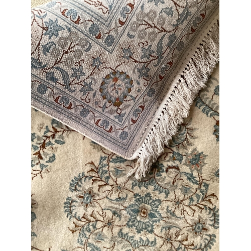 688 - An excellent quality  near pair of rugs, Persian, silk and wool, with beige ground and blue floral d... 