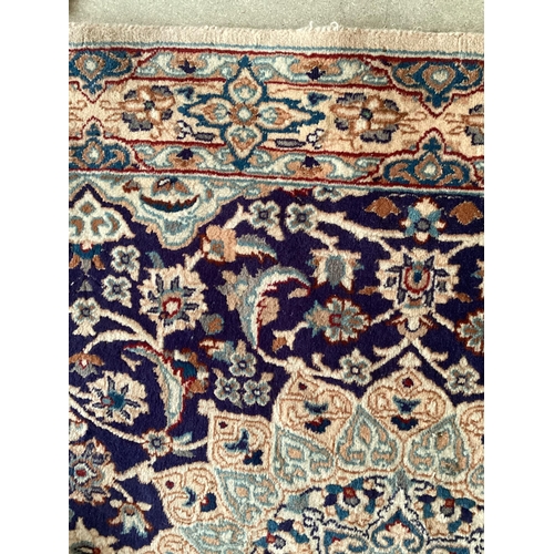 691 - A Persian wool rug,  blue and beige ground, with central star medallion, 114cm x 215cm, cleared from... 