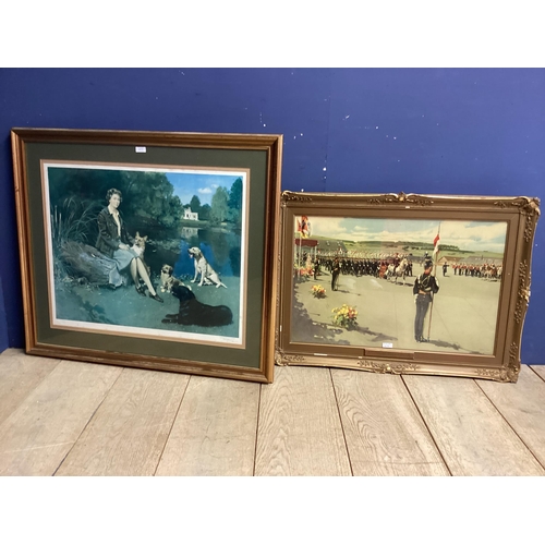 1063 - A large gilt glazed seated portrait print of the Her Majesty the late Queen Elizabeth II and her dog... 