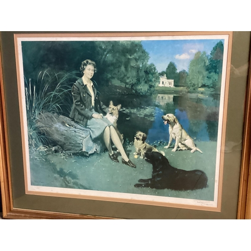 1063 - A large gilt glazed seated portrait print of the Her Majesty the late Queen Elizabeth II and her dog... 