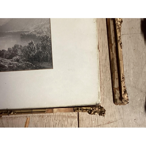 1064 - A pair of gilt glazed framed black and white etchings of lakeland scenes, some damage to frame