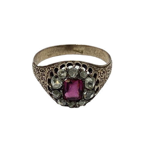 10 - An unmarked yellow metal 18th century ruby and diamond dress ring. Central cushion cut ruby of good ... 