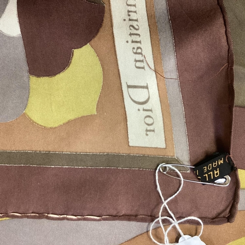 103 - CHRISTIAN DIOR, silk scarf in geometric browns and greens, in generally good condition, some minor w... 