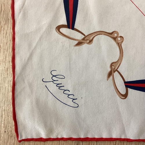 104 - Two GUCCI silk scarves, with snaffle patterns, vintage, tiny mark to the cream one. Both have been w... 