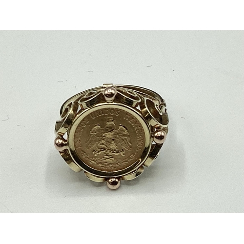 12 - A coin signet ring. Mexican two peso coin in an unmarked yellow metal mount. 4.40g. Size K.