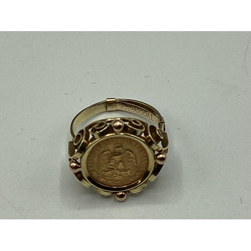 12 - A coin signet ring. Mexican two peso coin in an unmarked yellow metal mount. 4.40g. Size K.