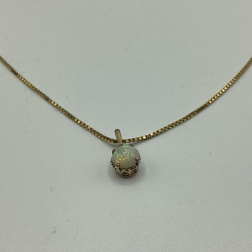 13 - A 9ct gold opal set pendant on a 9ct  box link chain. 20cm.2.60g.