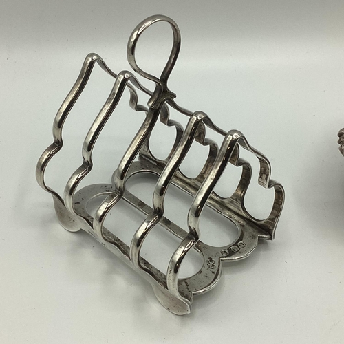 14 - A sterling silver Elkington and Co toast rack together with a sterling silver fork, a plated salt an... 