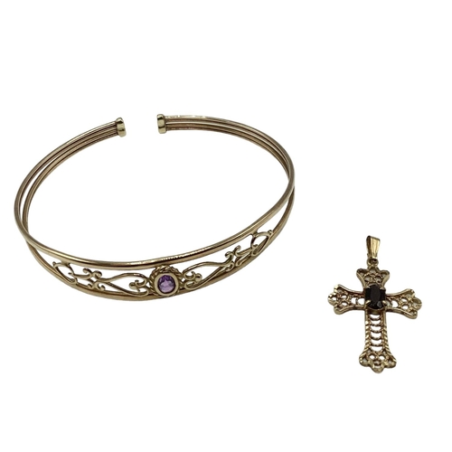 15 - A 9ct gold pierced bangle bracelet set with single amethyst together with a 9ct gold crucifix pendan... 