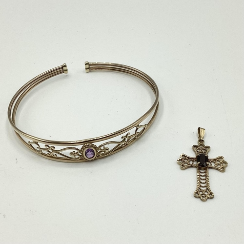 15 - A 9ct gold pierced bangle bracelet set with single amethyst together with a 9ct gold crucifix pendan... 