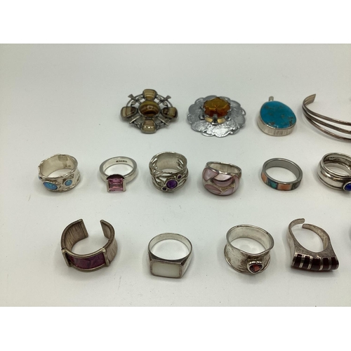 16 - A collection of sterling silver and white metal jewellery to include gem set rings , Scottish hardst... 