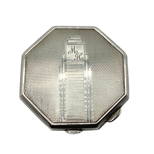 20 - Av sterling silver compact, hexagonal form with engine turned decoration. Birmingham 1947. 67g